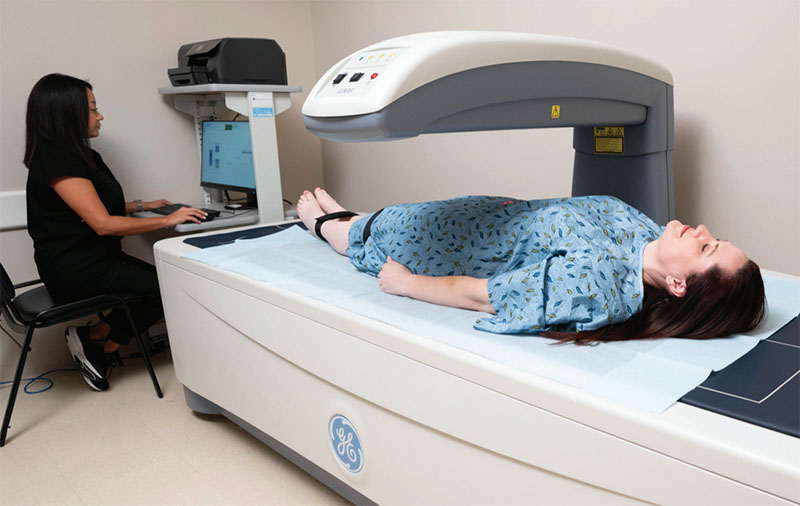 Patient undergoing DEXA body composition scan — precision metabolic assessment at Pravida Health